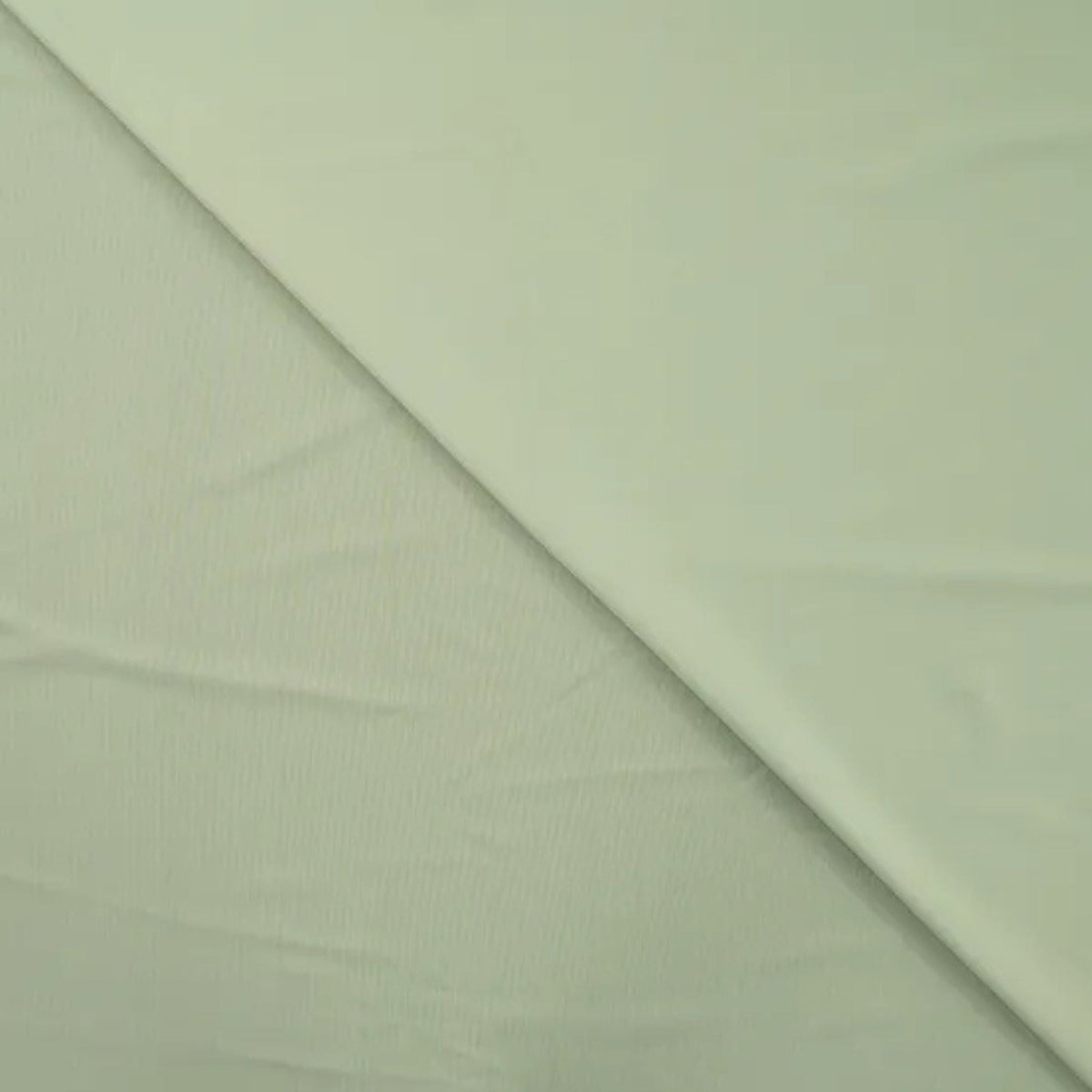 Solid dusty mint green stretch jersey fabric for sportswear and swimwear – soft, breathable, and perfect for activewear and performance clothing