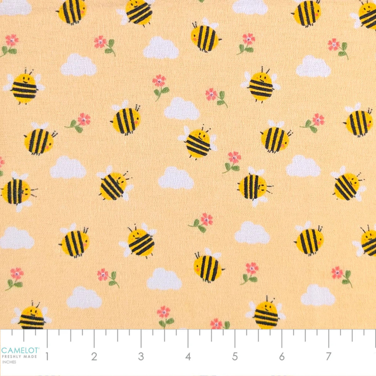 Camelot Fabrics Bumble Bees peach cotton flannel fabric featuring cheerful yellow bees, fluffy clouds, and pink flowers from the Fleece and Flannel 2026 Collection.