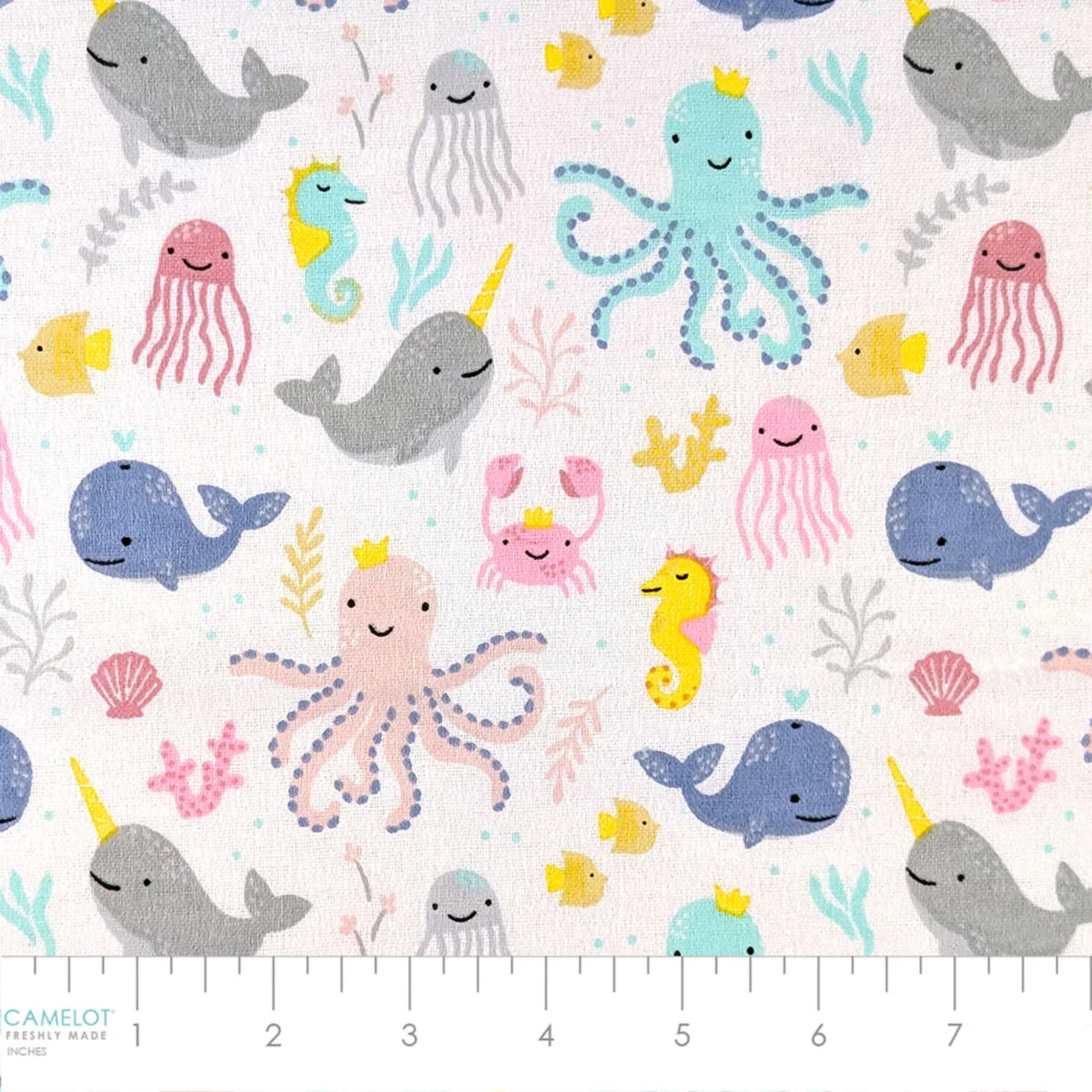Ocean Baby white cotton flannel fabric featuring narwhals, whales, octopuses, jellyfish, seahorses, fish and coral.
