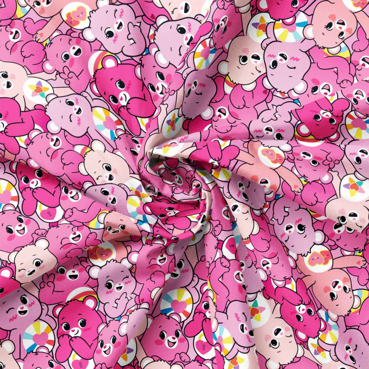 “Licensed pink Care Bears cotton fabric featuring a repeating pattern of cheerful pink and blush Care Bears in cute, playful poses.”