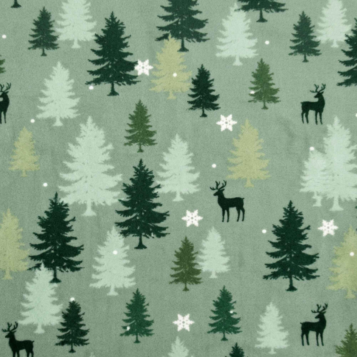 Double brushed flannel fabric featuring evergreen trees, deer silhouettes, snowflakes, and falling snow on a sage green background.