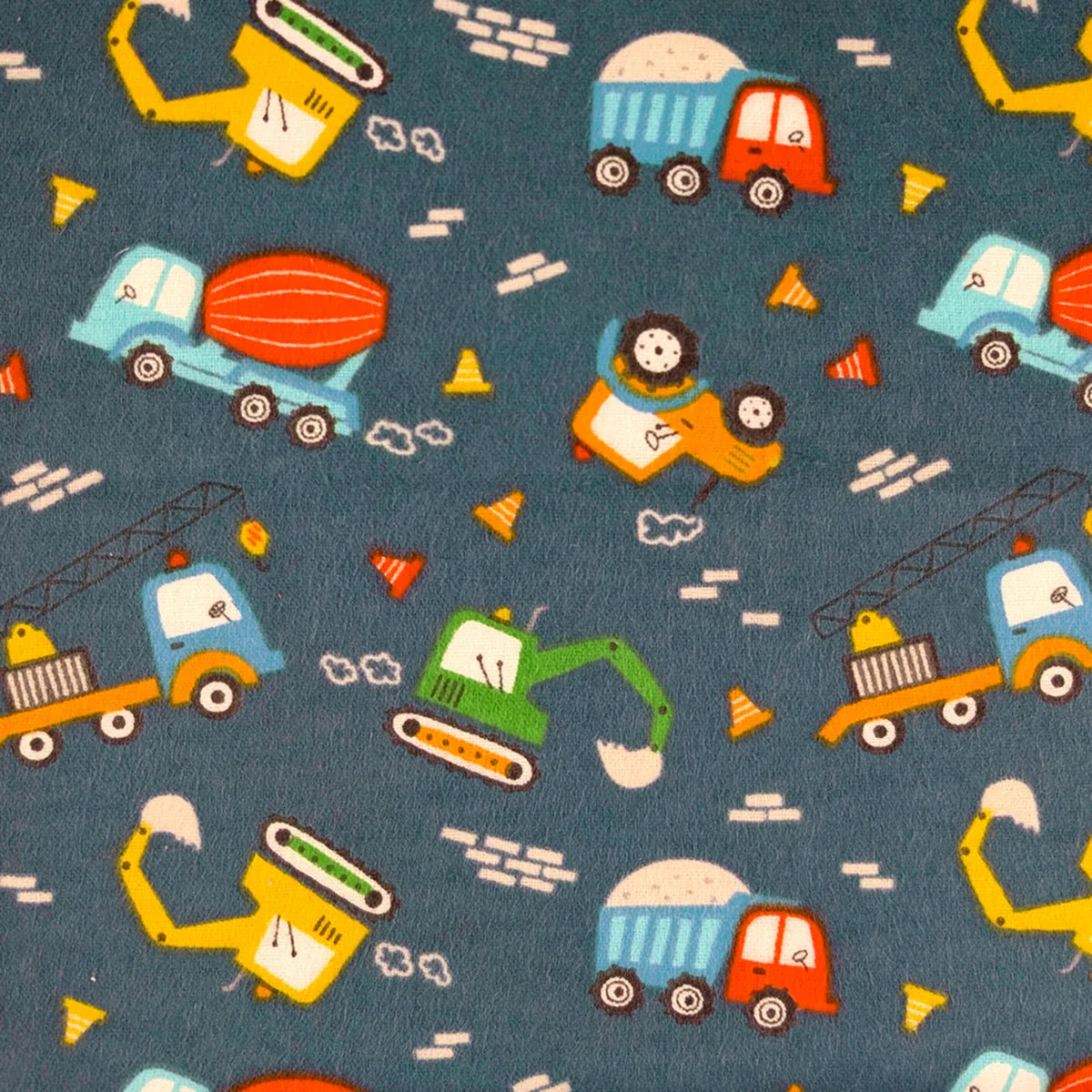 Navy cotton flannel fabric with colorful construction vehicles including excavators, cranes, dump trucks and cement mixers.