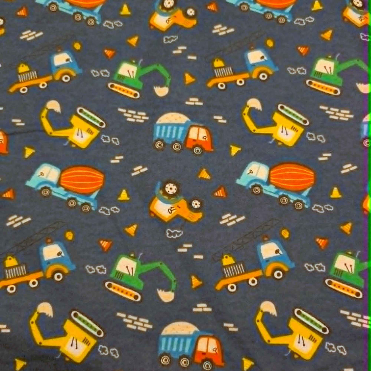 Navy cotton flannel fabric with colorful construction vehicles including excavators, cranes, dump trucks and cement mixers.