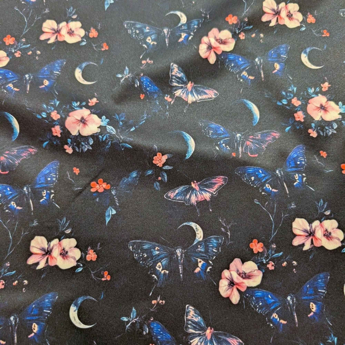 Midnight Butterfly Moon Garden exclusive waterproof PUL fabric with blue butterflies, pink flowers and crescent moons on black