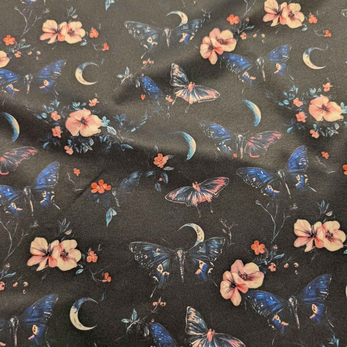 Midnight Butterfly Moon Garden exclusive waterproof PUL fabric with blue butterflies, pink flowers and crescent moons on black