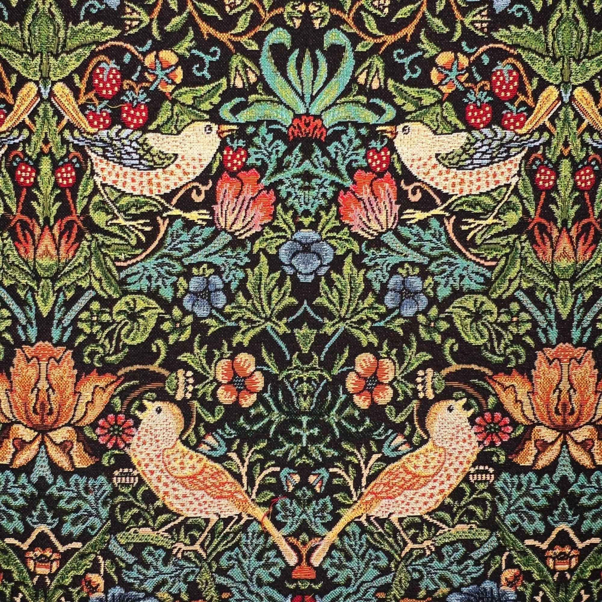 Black Gobelin tapestry fabric featuring golden birds, red strawberries, ornate flowers and scrolling green foliage.