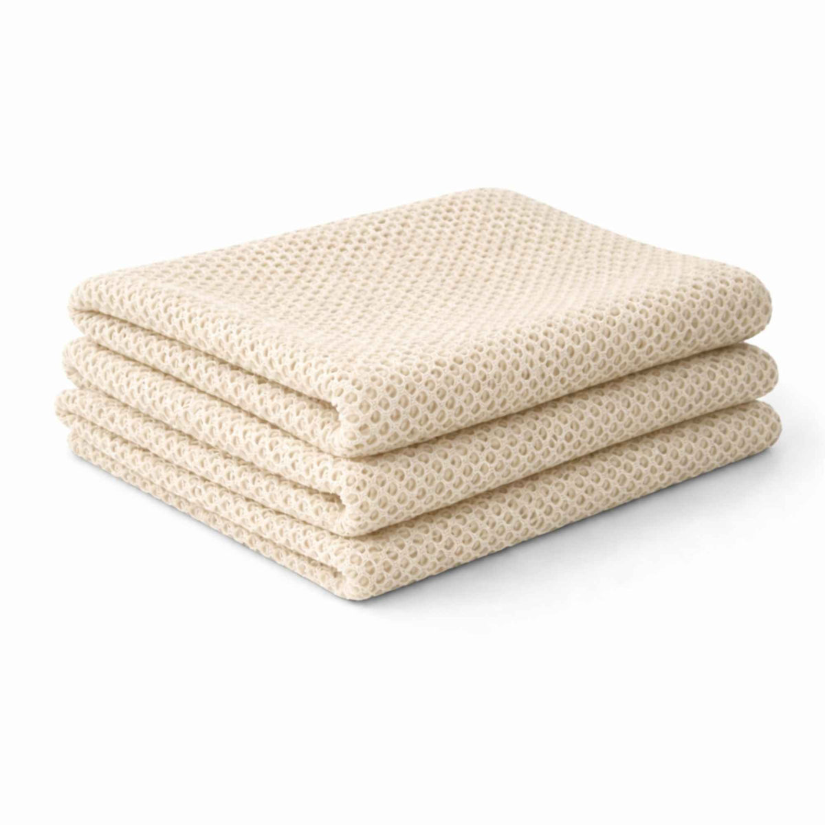 Stacked ivory fish net mesh fabric neatly folded showing texture and thickness