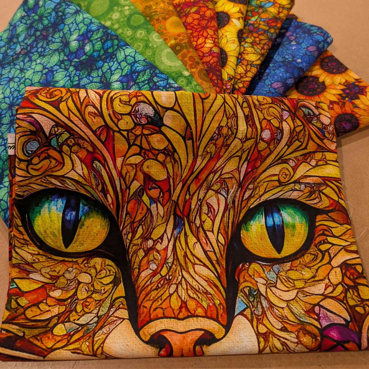 Sonny in the Sunflowers fabric bundle by Peggy Collins featuring colorful cat face fabric with coordinating sunflower and mosaic quilting cotton fabrics