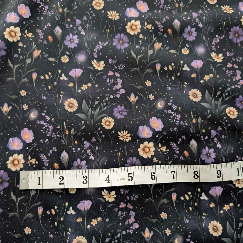 Starlit Wildflower Meadow exclusive waterproof PUL fabric with purple and golden flowers, crescent moons and glowing stars on black