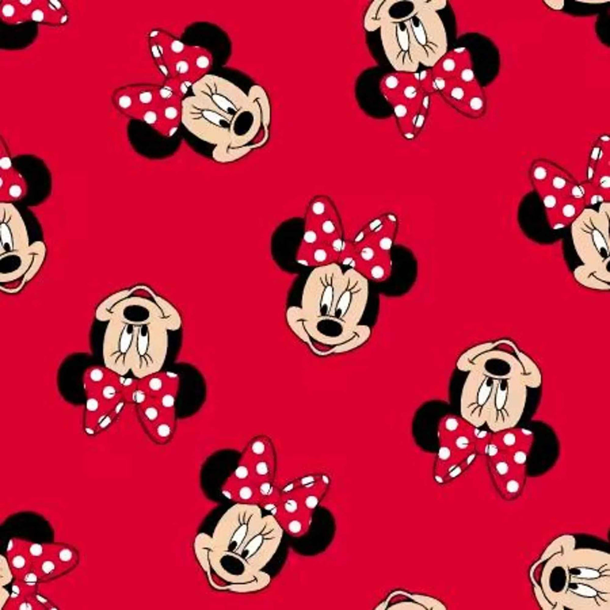 Disney Minnie Mouse faces and polka dot bows on red cotton fabric by Springs Creative CP85625