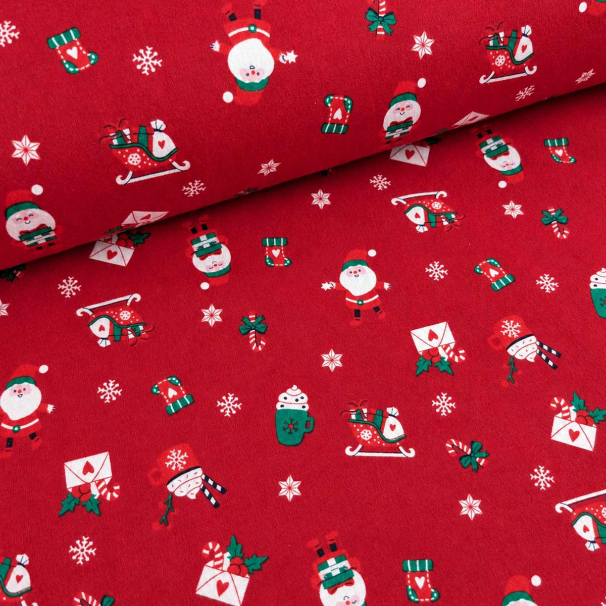 Red Christmas cotton flannel with Santa, sleighs, stockings, cocoa mugs, candy canes and white snowflakes, accented in green and black.