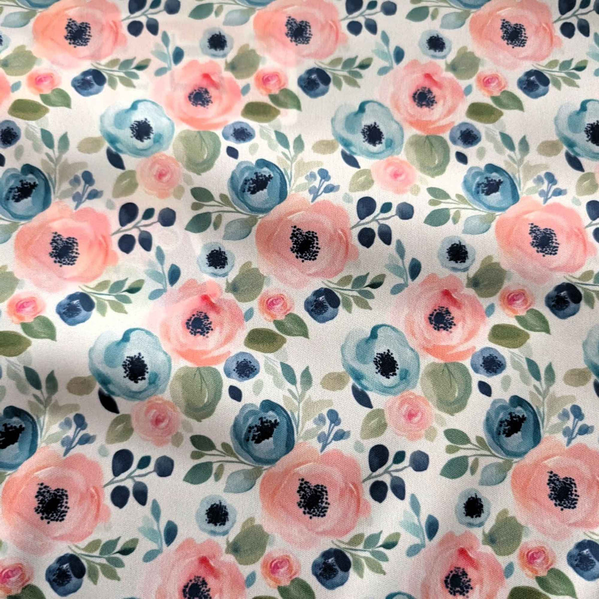 Blush and Blue Watercolour Blooms exclusive waterproof PUL fabric with pink and blue flowers and green leaves on teal