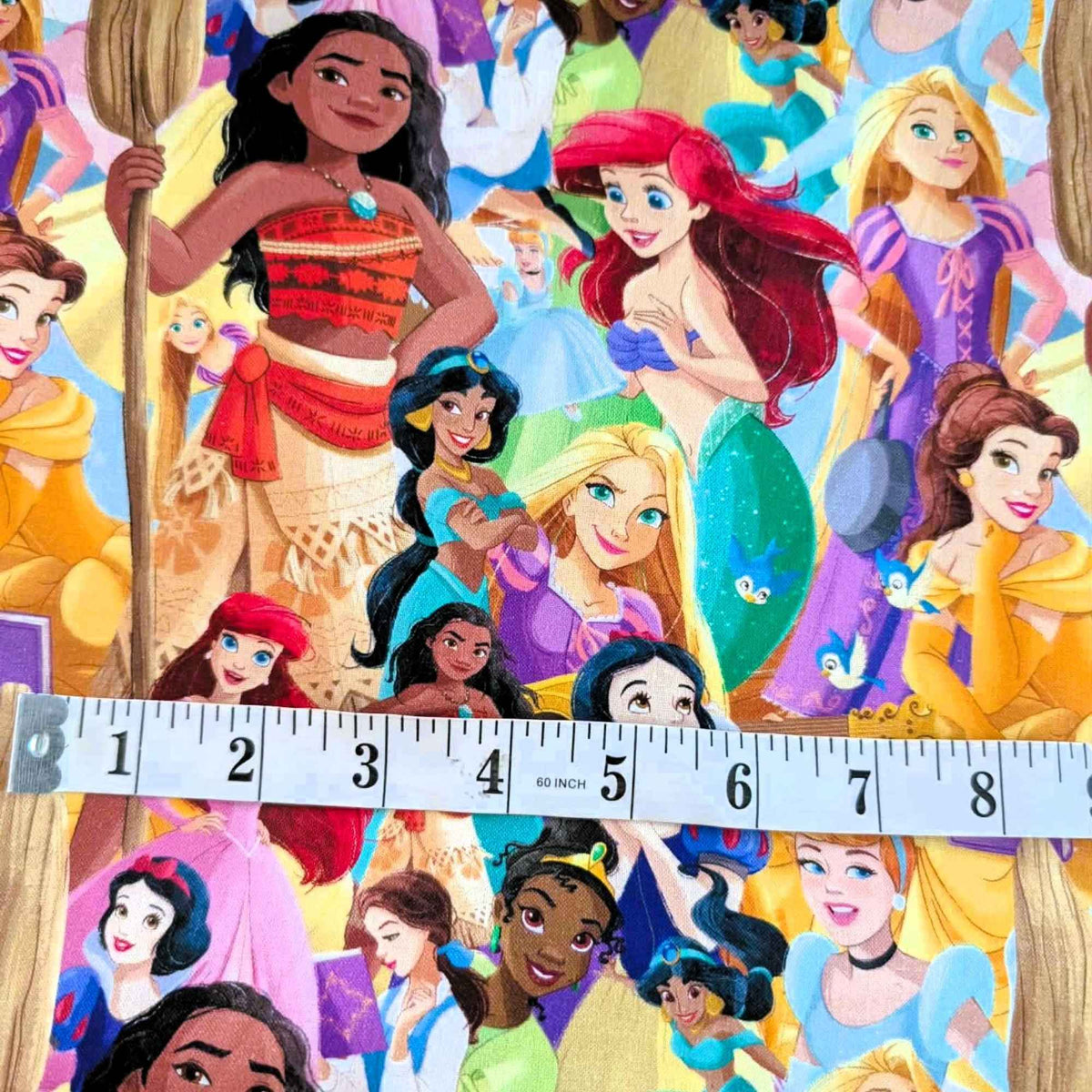 Disney Princess character collage cotton fabric by Springs Creative CP80523