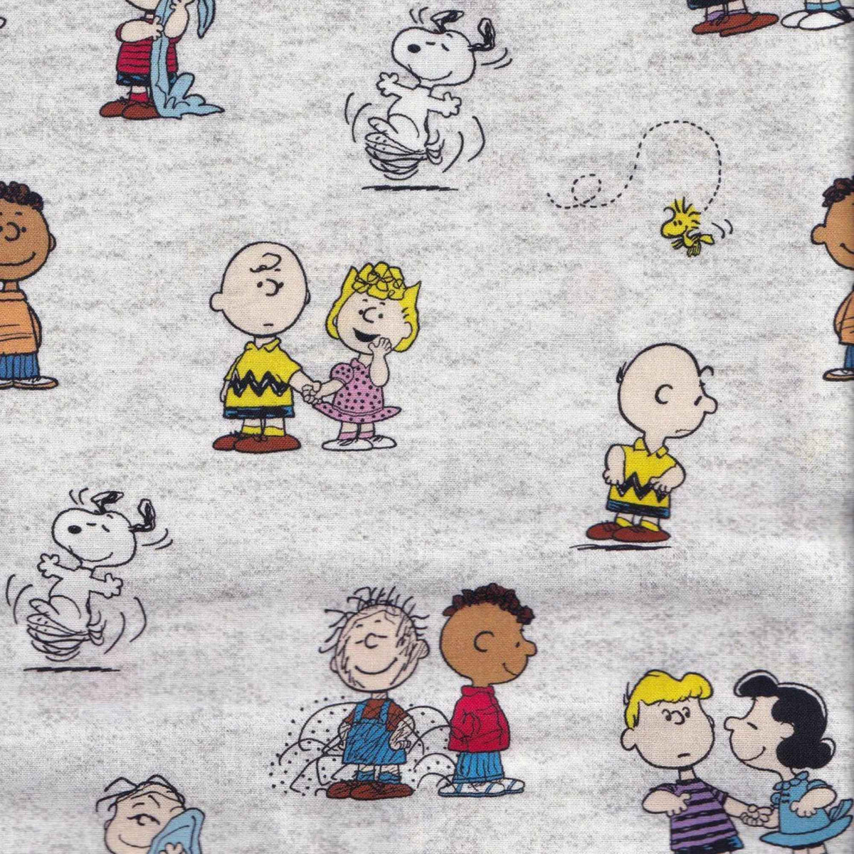 Peanuts gang character toss cotton fabric on light grey by Springs Creative CP78731