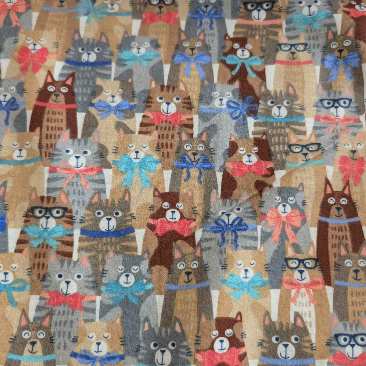 Double brushed flannel fabric featuring whimsical cats wearing colorful bows and collars on a light beige background.