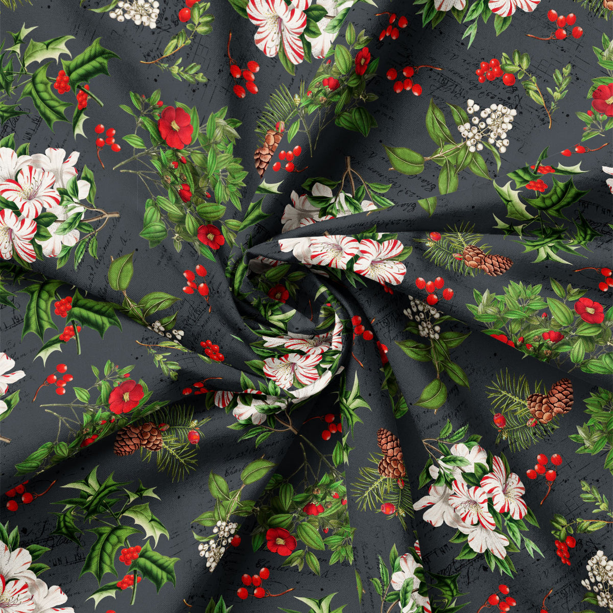 Detail view of Joy to the World Holiday Botanicals on Charcoal quilting cotton showing print scale and drape.