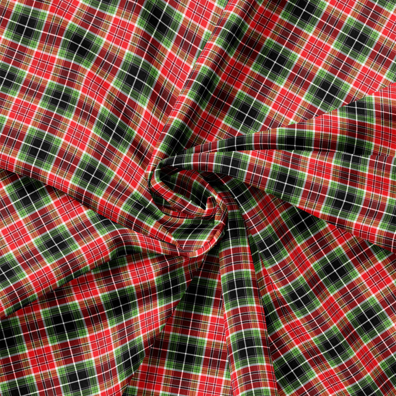 Detail view of Joy to the World Classic Christmas Plaid quilting cotton showing print scale and drape.