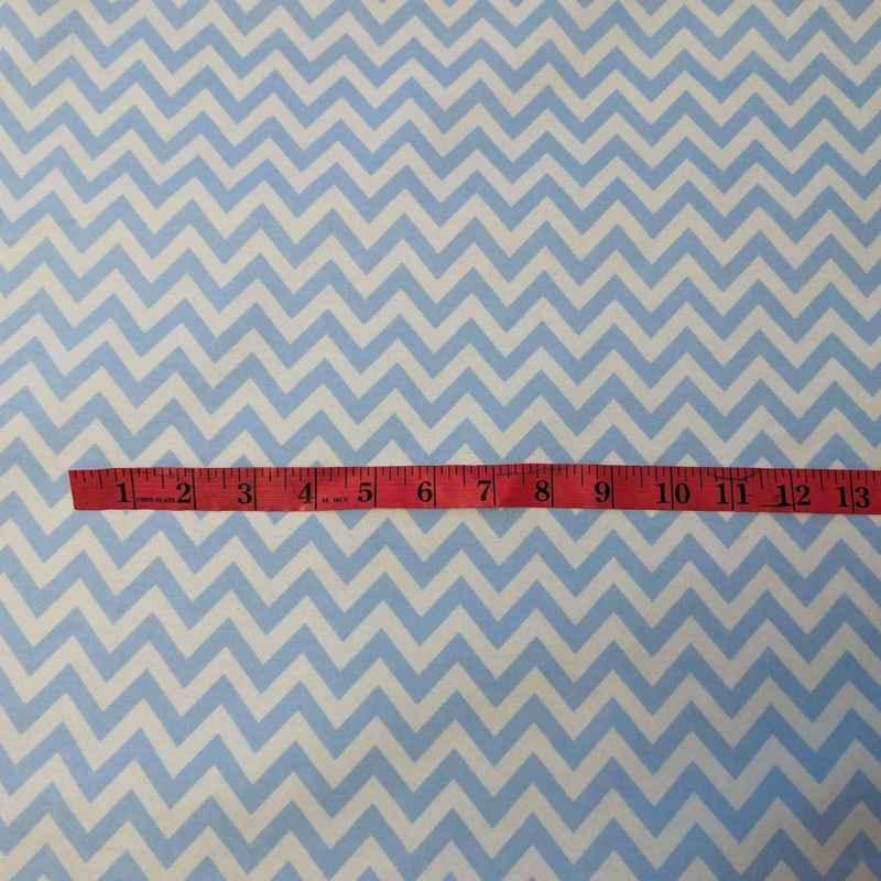 Blue and white chevron cotton flannel fabric, brushed on both sides and 62 inches wide, ideal for quilting and blankets.