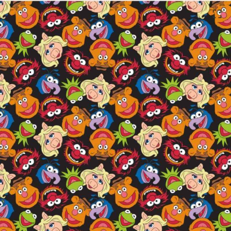 Colorful Disney Muppets cotton flannel fabric featuring Kermit, Miss Piggy, Animal, Gonzo, and other characters on a black background, licensed by Camelot Fabrics.